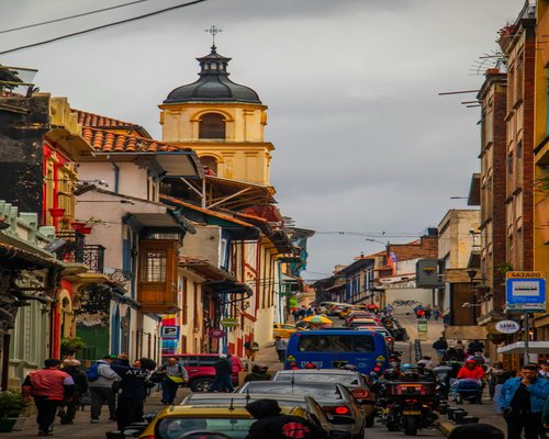 Colombian city street showing urban commuters
